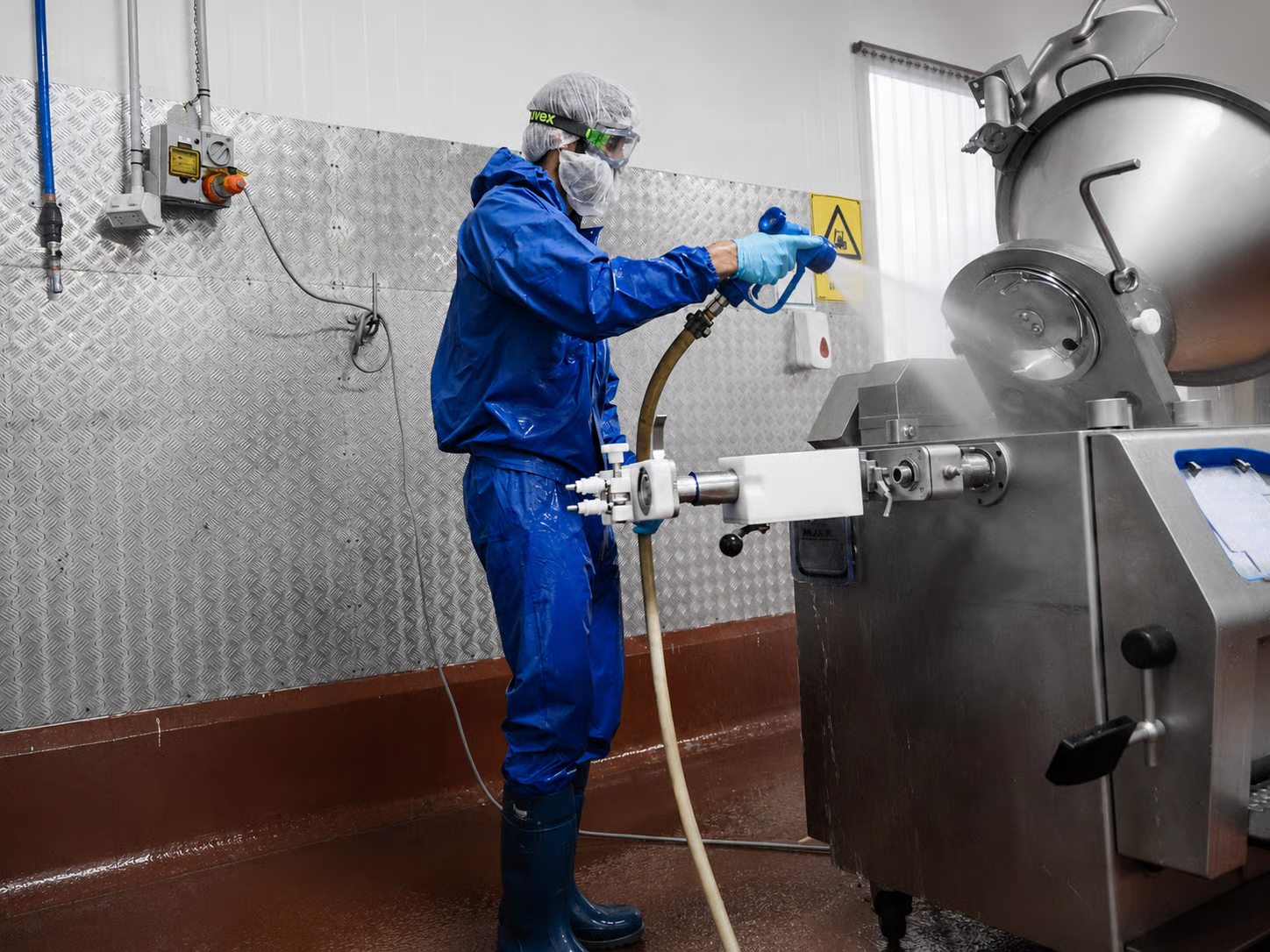 Emera team cleaning machinery